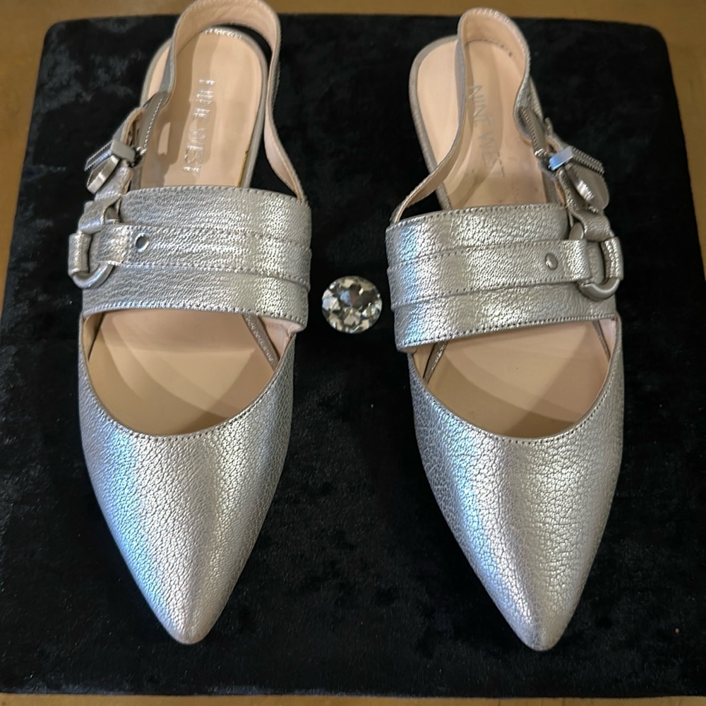 Nine West flat pointy sandals in new condition.  Very nice straps with buckles.